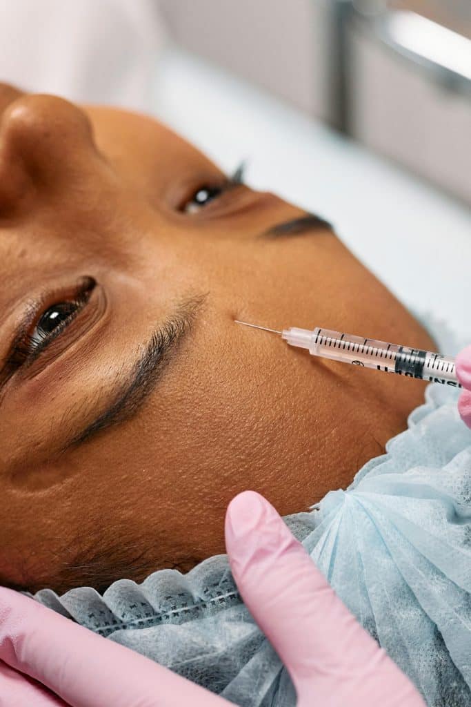 Injecting Person's Forehead